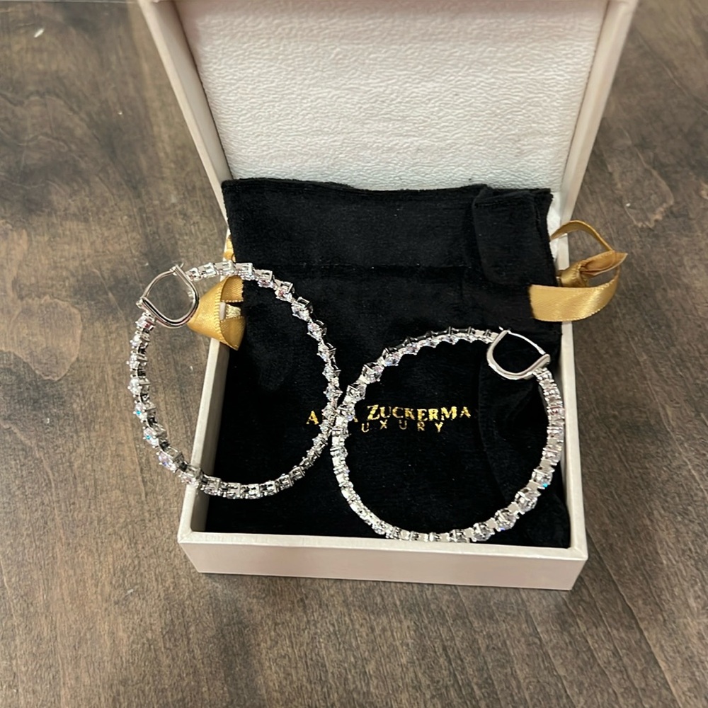 Bold and glamorous large chrystal hoops. Worn once.  Perfect condition.
